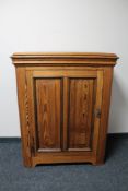 An antique pitch pine cabinet