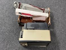 An RS 3000 projector viewer and a box of cine cameras, camera tripods,