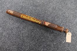 A wooden replica truncheon