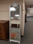A chrome coloured framed cheval mirror