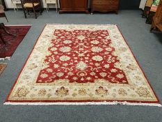 A Zeigler design carpet, on red ground,