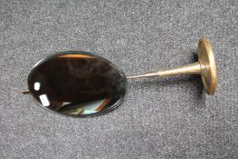 An adjustable bathroom shaving mirror on stand