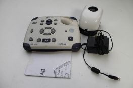 An electronic clock/audio disc player for the deaf