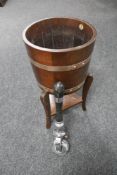 An oak copper bound planter on stand by R.