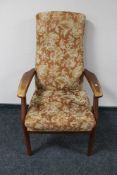 A teak framed high back armchair