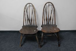 A pair of antique spindle back kitchen chairs