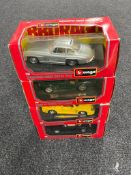 Four boxed Burago 1:24 scale die cast vehicles including Ferrari F40,