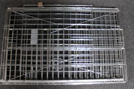 A folding metal dog cage
