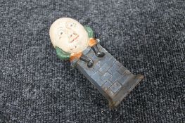 A cast iron Humpty Dumpty money box