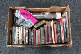 A box of assorted books to include eleven paperback James Bond books, Dickens,