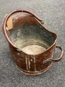 A Victorian hammered copper coal bucket