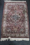 A Turkish hand-woven silk pile rug, of Persian Isfahan design,