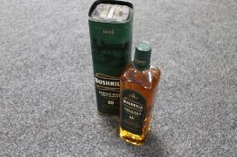 A bottle of Bushmills single malt Irish Whiskey aged 10 years,