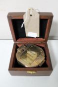 A brass cased natural sine compass in fitted box