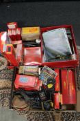Three boxes of Hornby railways stations, accessories, track and control units,