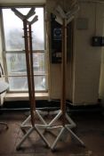 Four contemporary wooden hat and coat stands