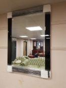 A contemporary black glass framed mirror, 85.