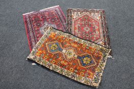 Three woolen Persian hearth rugs