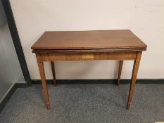 A George III inlaid mahogany turnover top tea table,