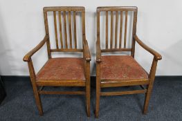 A pair of 20th century oak carver armchairs