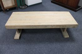 A thick oak refectory coffee table