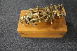 A brass theodolite in fitted box