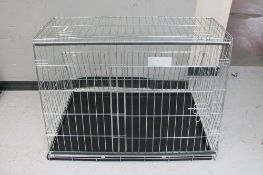 A folding metal dog cage
