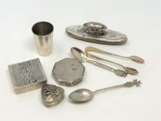 A collection of silver; compacts, tot,