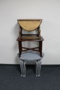 A nest of three tables together with an oak drop leaf coffee table and a further mahogany coffee