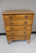 A 20th century oak five drawer chest