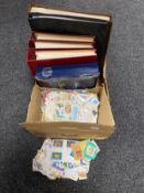 A box of quantity of loose stamps together with an album of Queen Elizabeth II silver jubilee