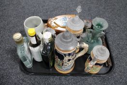 A tray of beer steins, antique soda glass, ornamental flintlock pistol, wooden wall plaques,