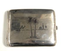 A continental white metal cigarette case with niello detail