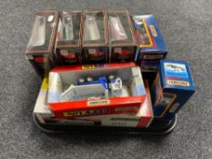 A tray of ten boxed exclusive first edition die cast busses together with four other die cast