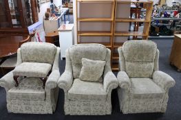 Three armchairs in a floral fabric and a matching footstool