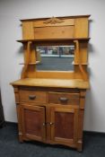 An Edwardian pine mirror backed sideboard
