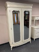 A Laura Ashley cream double mirror door wardrobe,