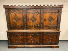 A good quality carved oak sideboard, with castellated frieze,