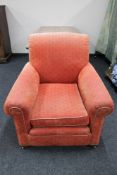 An early twentieth century armchair in red fabric