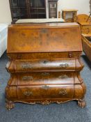 A reproduction walnut effect Dutch style bombe bureau
