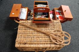A wicker picnic basket together with a carpet beater and sewing box with accessories