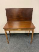 A George III inlaid mahogany tea table,