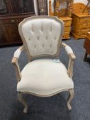 A French style salon armchair in beige button fabric