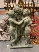 A concrete garden figure, the three graces,