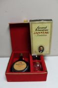 Two bottles of alcohol - Janneau Fondateur Grand Armagnac and Michel Faure Armagnac with glasses