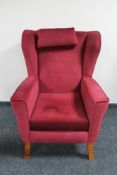 A mid 20th century wingback armchair