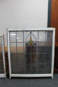 A large framed stained glass leaded window