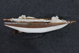 A mid century wooden pond yacht