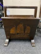 A carved Oriental designed magazine rack