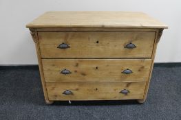An antique pine three drawer chest